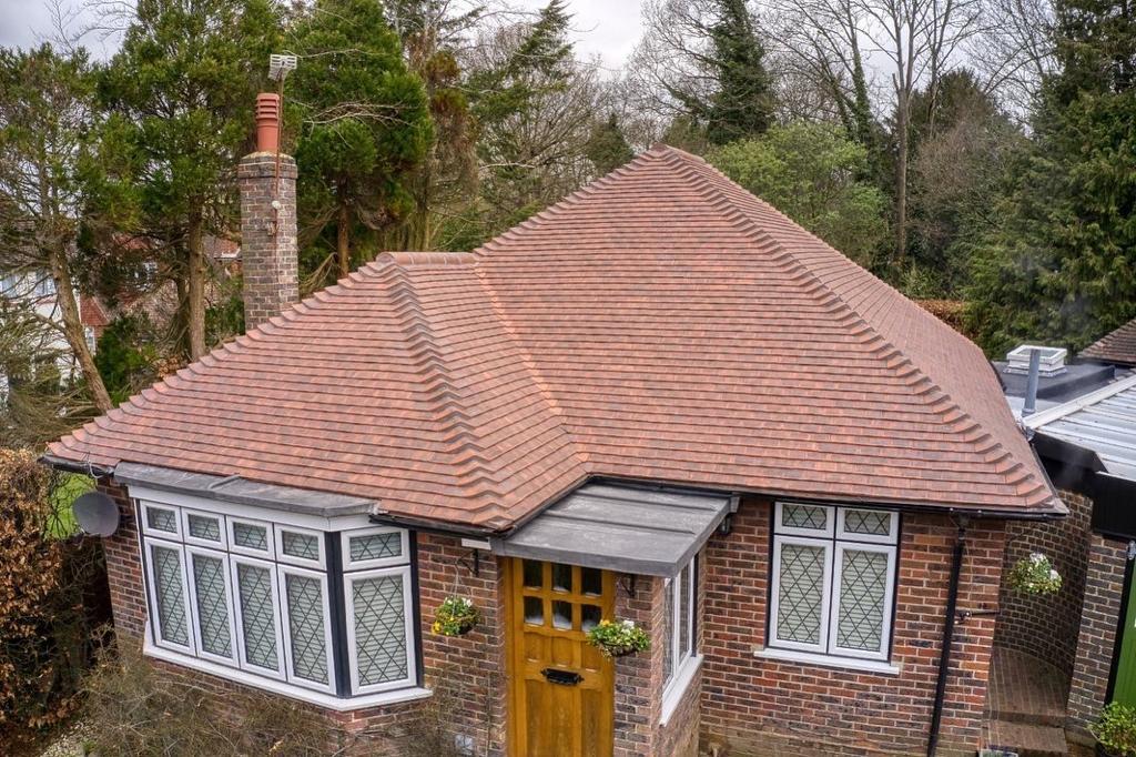 Light brown, lead roof on bungalow