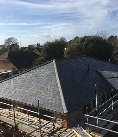a large grey roof being installed by Albec Roofing